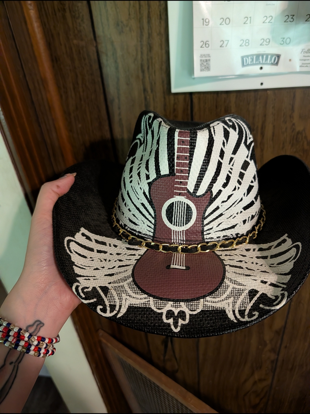 Women’s Black Straw Cowboy Hat with Guitar Graphic and Chain Accent